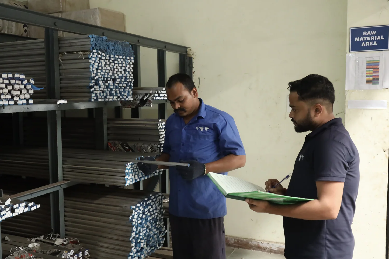 Bar stock checked against its paperwork in the raw material area