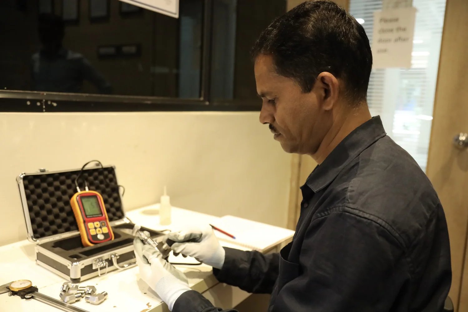 An engineer working with inspection equipment